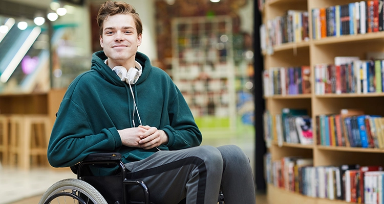 smiling young man in wheelchair